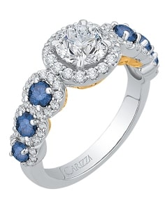 A halo engagement ring with sapphire side stones from Shah Luxury.