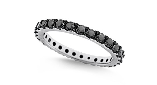 a white gold stackable fashion ring inlaid with black diamonds around the ring