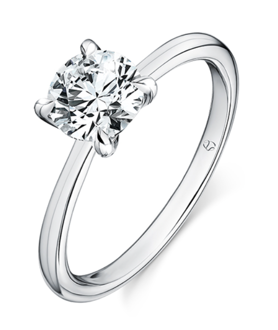 A platinum solitaire engagement ring with round cut center diamond.