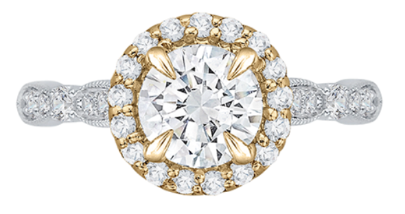A white and yellow gold halo engagement ring encrusted with diamonds.