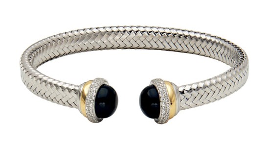 A mixed metal cuff bracelet with diamond and black onyx accents, available at Brockhaus Jewelry.
