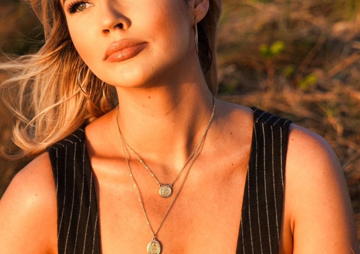 woman in sun with necklace on