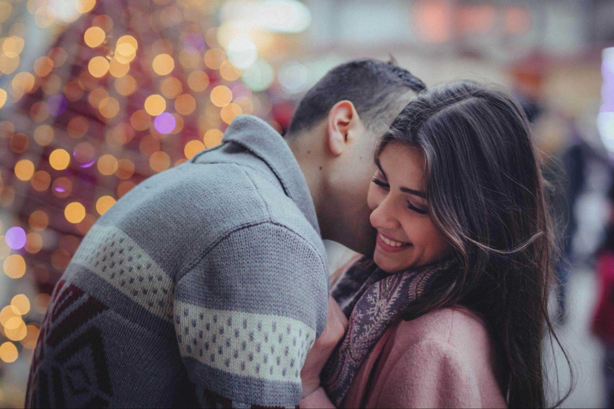 A couple embracing during Valentine’s Day in a public space.