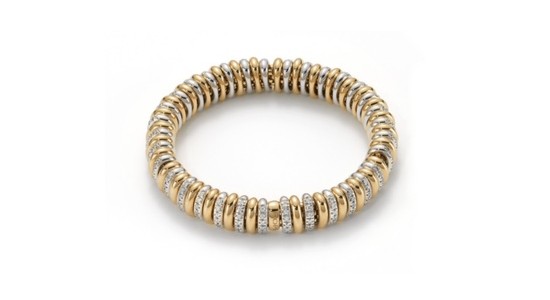 a chunky, mixed metal bracelet with diamond accents